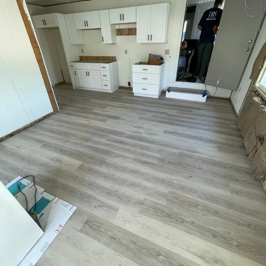 DRS Floors crew installing vinyl plank flooring in Florida home