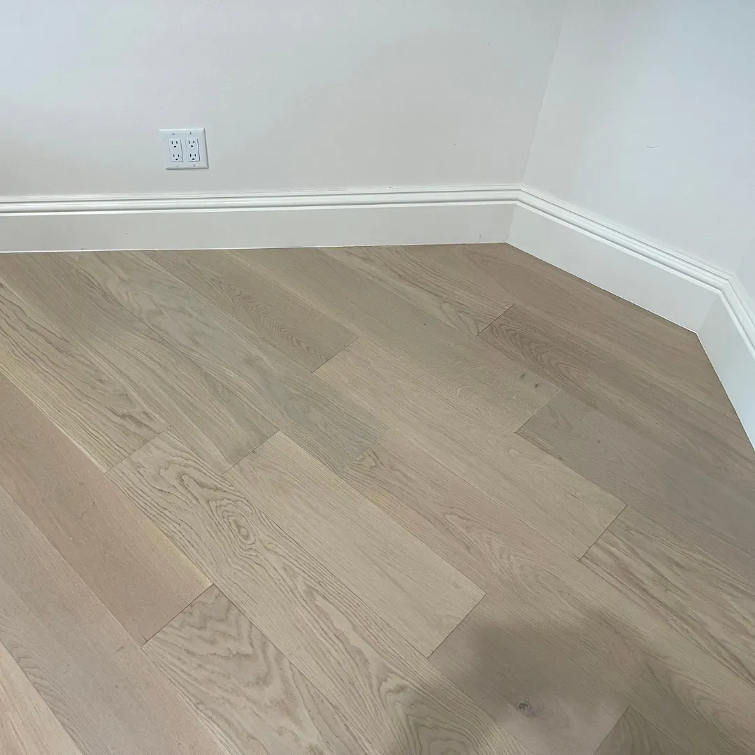 Engineered white oak hardwood flooring in bright corner