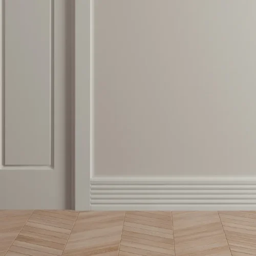 Light parquet wood flooring with white baseboard and door trim