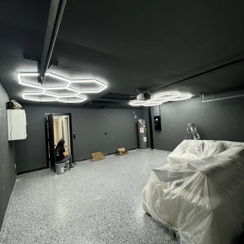 Epoxy garage floor installation with hexagon LED lighting